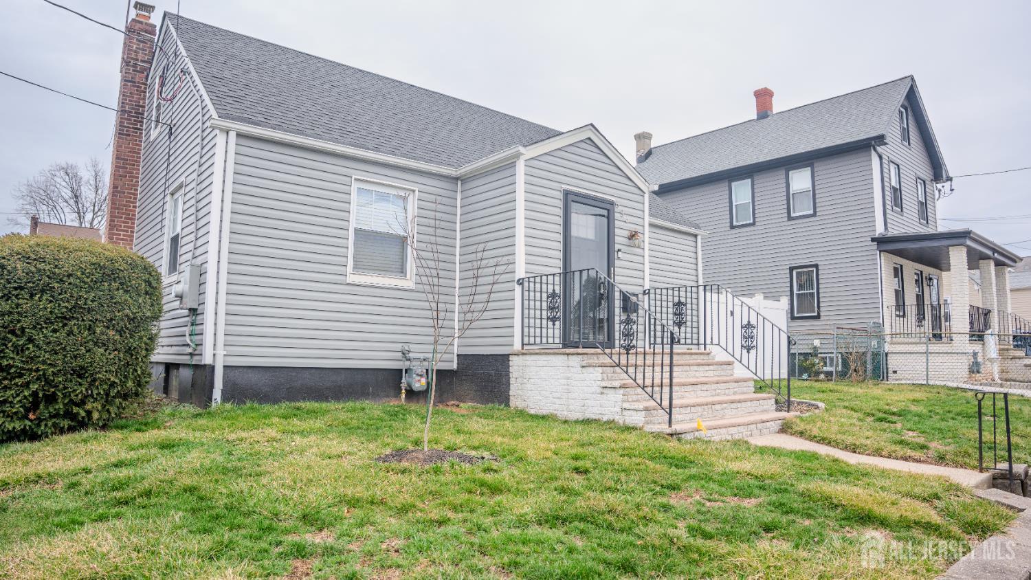 636 Lee Street Perth Amboy, NJ 08861 - Photo 2 of 35 a view of a house with backyard and a garden