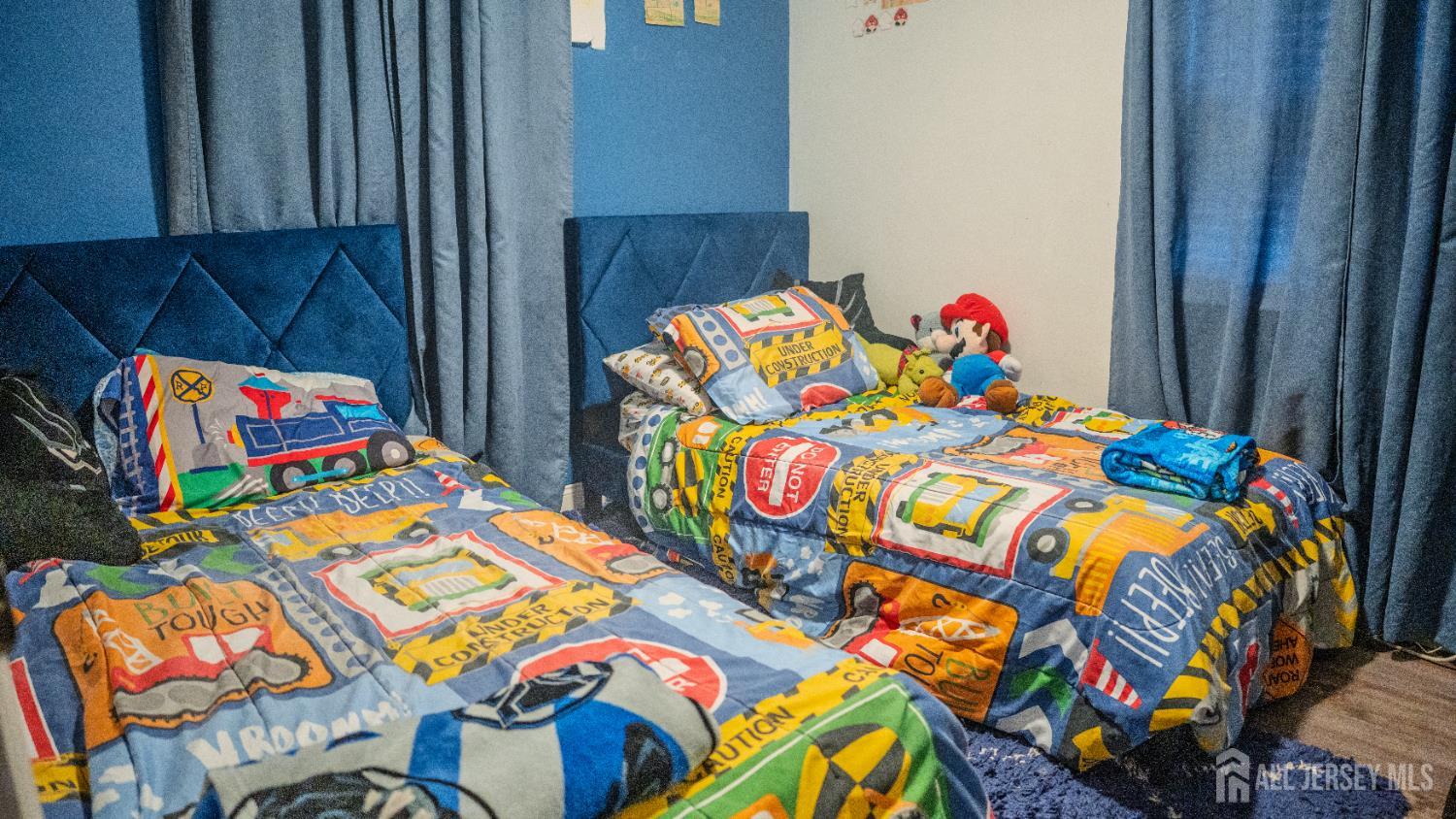 636 Lee Street Perth Amboy, NJ 08861 - Photo 24 of 35 a kids room that has two bed and a painting on the wall