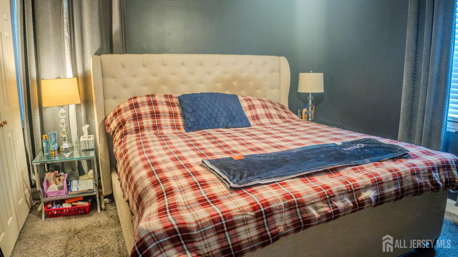 636 Lee Street Perth Amboy, NJ 08861 - Photo 26 of 35 a bedroom with a bed and painting on the wall