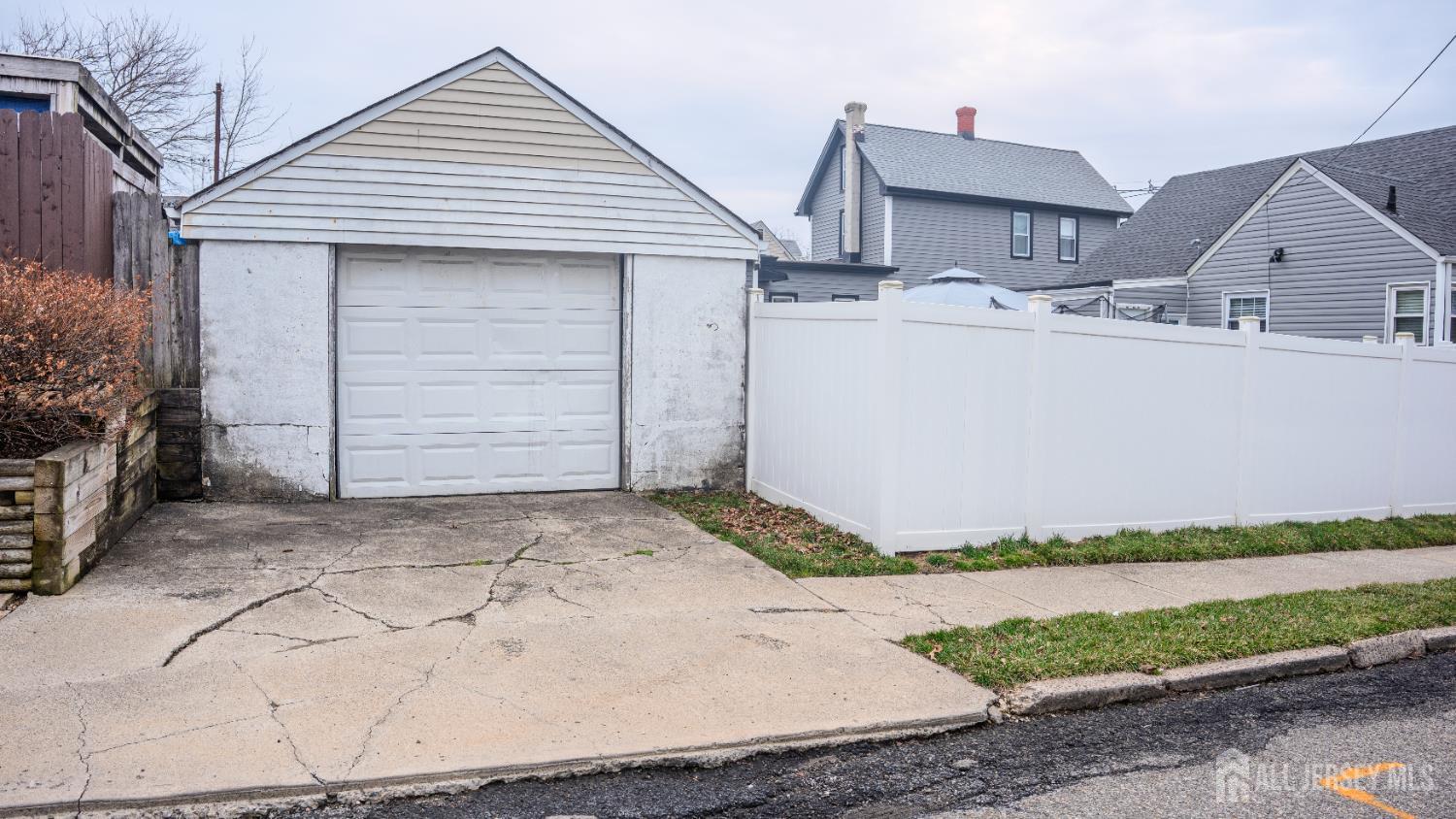 636 Lee Street Perth Amboy, NJ 08861 - Photo 34 of 35 a front view of a house with a yard and garage