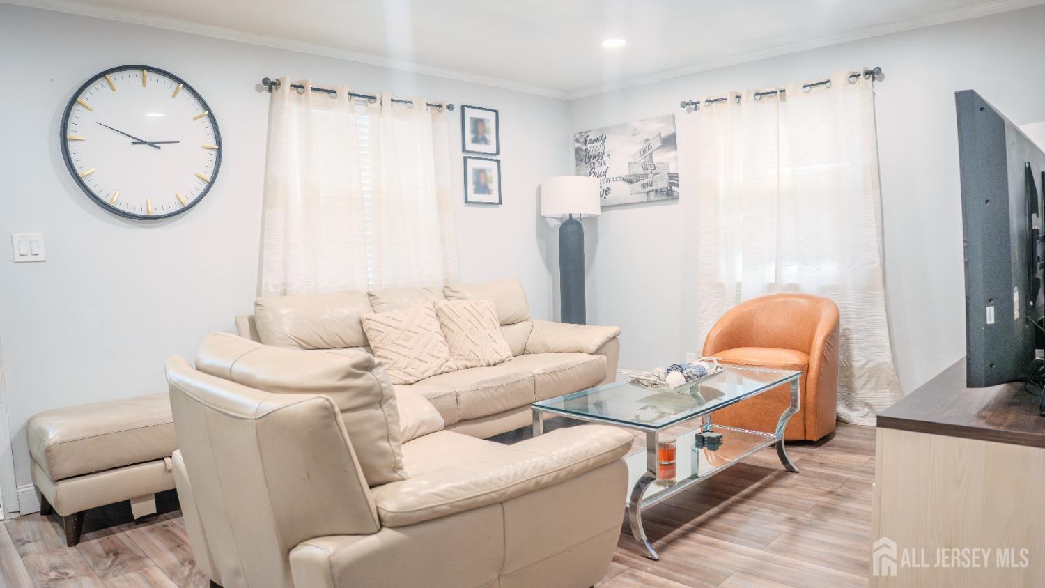 636 Lee Street Perth Amboy, NJ 08861 - Photo 4 of 35 a living room with furniture a mirror and a window