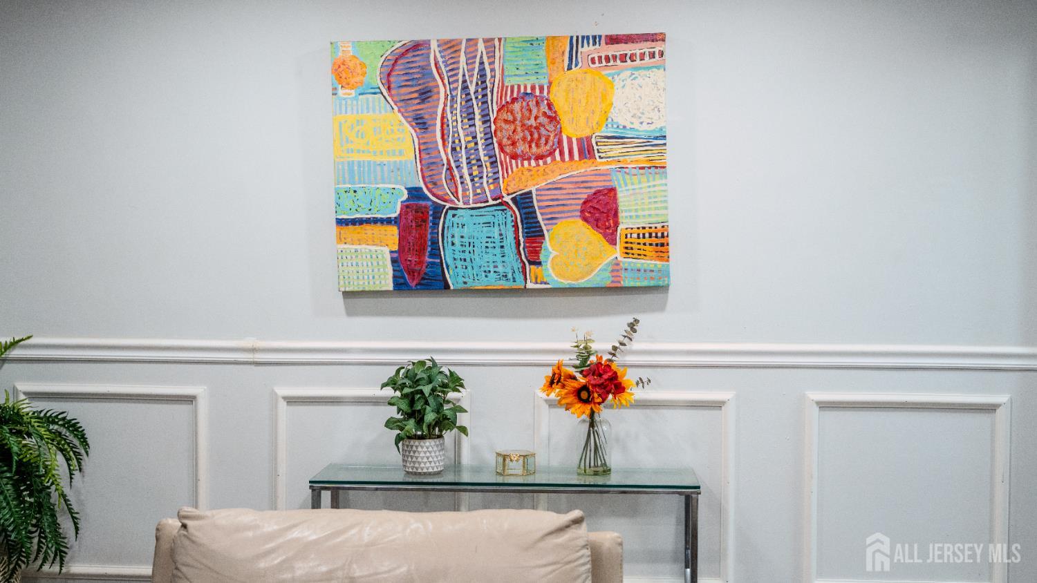 636 Lee Street Perth Amboy, NJ 08861 - Photo 5 of 35 a room with painting on the wall and a potted plant