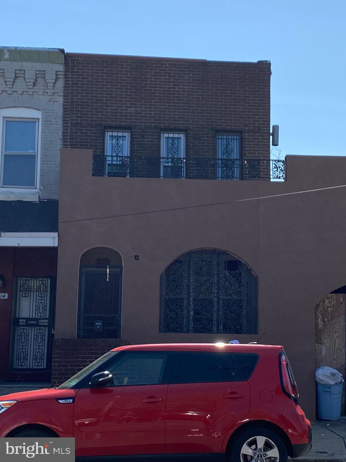 a car parked in front of a building