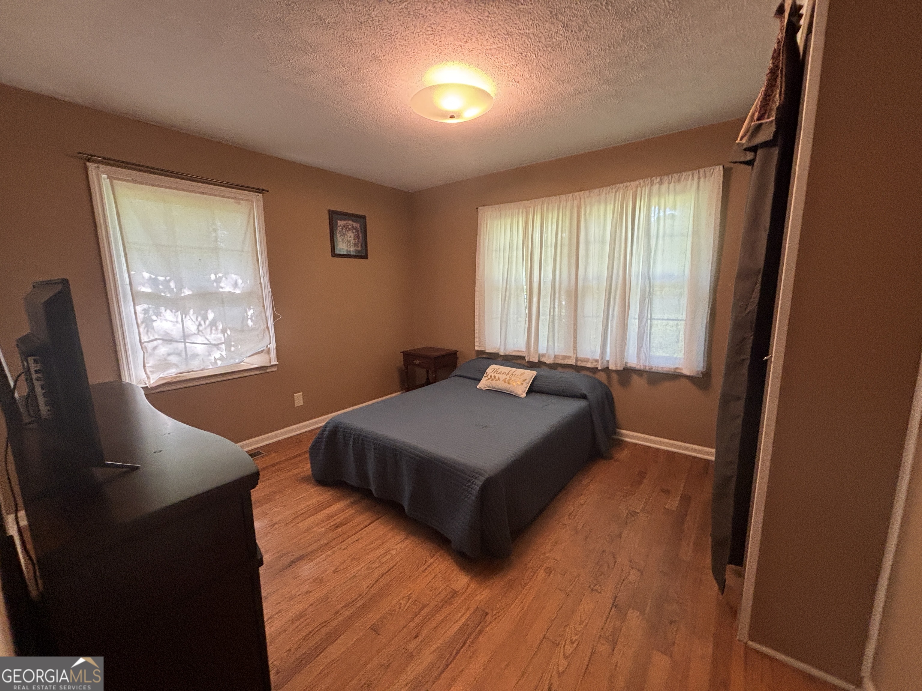 152 Crest Drive Cochran, GA 31014 - Photo 32 of 54 a room with two beds and a window