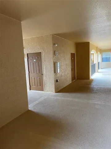 a view of a hallway with a livingroom