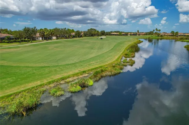 an aerial view of a golf course with a park