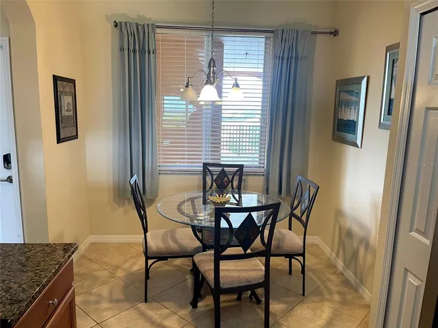 a dining room with furniture and window
