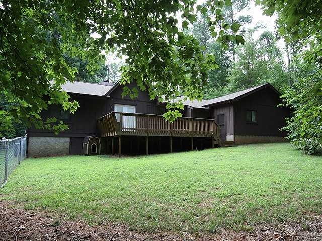 9101 Ray Road Raleigh, NC 27613 - Photo 14 of 14 a view of a backyard with a garden and trees