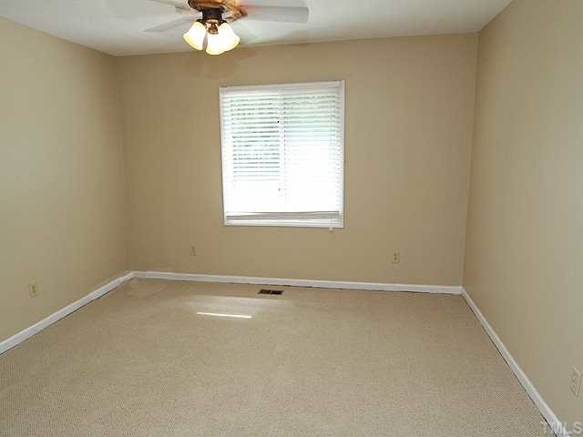 9101 Ray Road Raleigh, NC 27613 - Photo 8 of 14 an empty room with a window