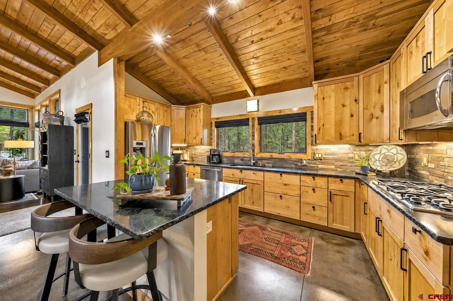 24 Monarch Crest Trail Durango, CO 81301 - Photo 15 of 45 a kitchen with stainless steel appliances granite countertop a sink and cabinets