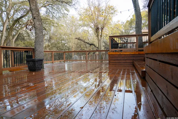 a view of a front door and bedroom from a window