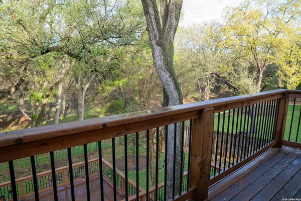 a view of a hallway with wooden floor and closet
