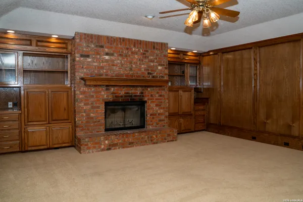 a kitchen with stainless steel appliances granite countertop wooden cabinets a sink and a stove