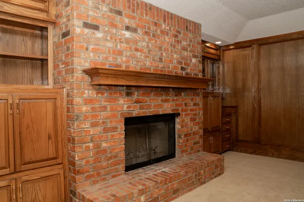 a view of wooden floor and windows in a room