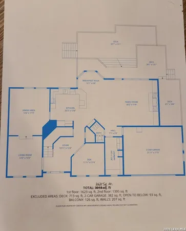 a view of a brick house with large windows and a table