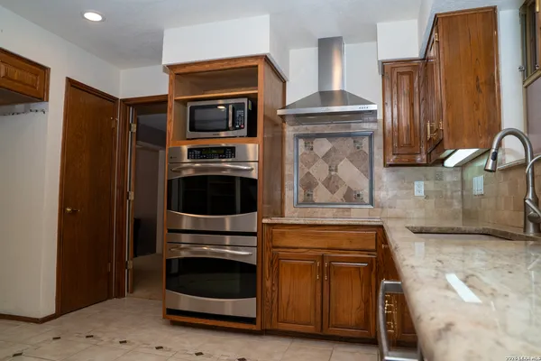 a bathroom with a shower and mirror