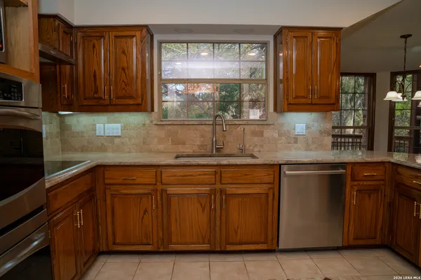 a view of a kitchen with furniture and a window