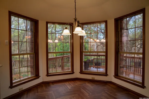 a view of a livingroom with an empty space and a window