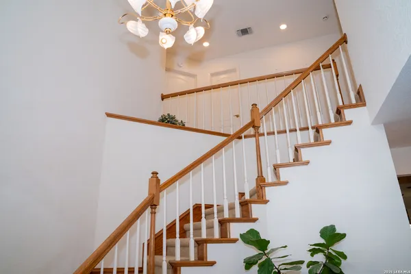 an empty room with sliding door and wooden floor