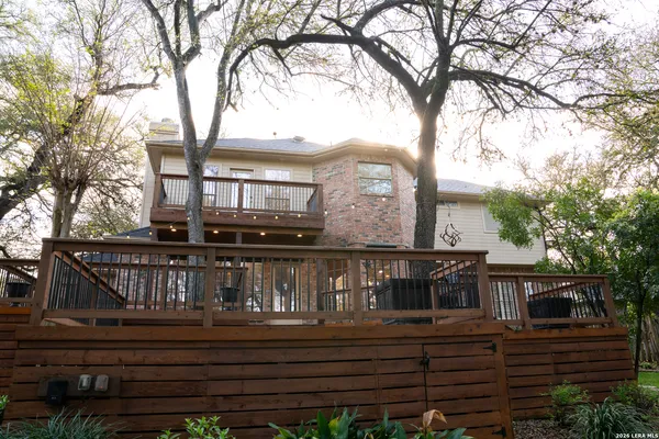 a view of a brick house with a balcony