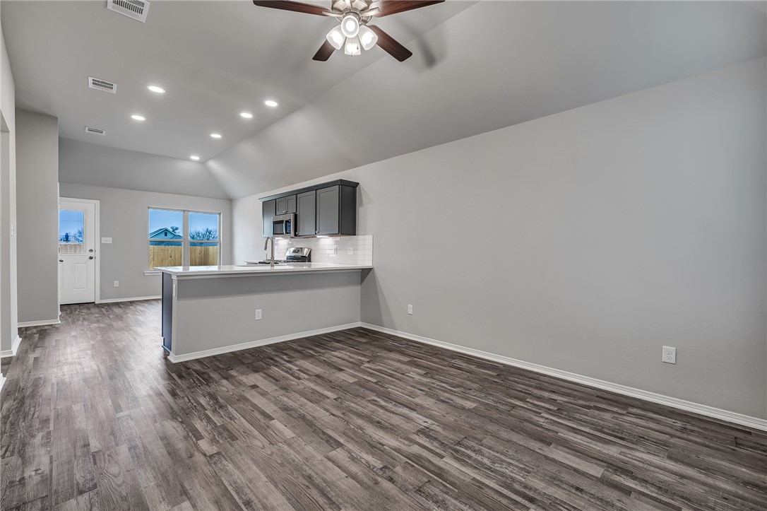 1231 High Street Navasota, TX 77868 - Photo 4 of 18 a view of a kitchen with stove and cabinets