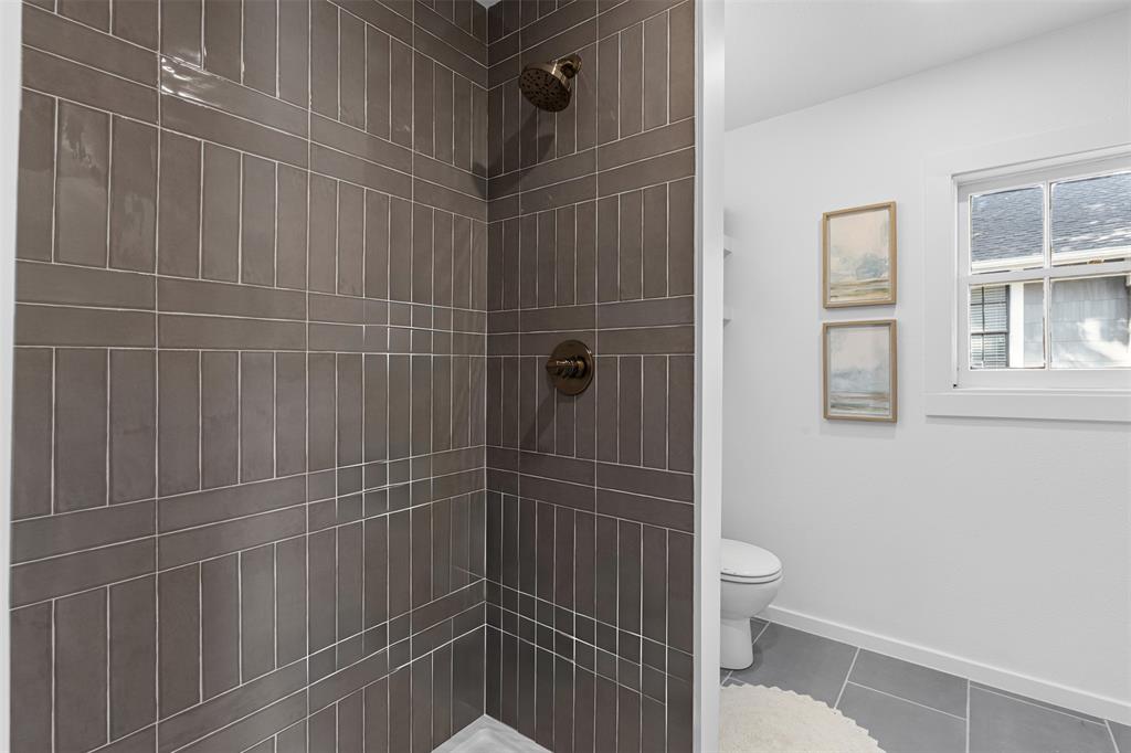 4723 El Campo Avenue Fort Worth, TX 76107 - Photo 13 of 21 a bathroom with a toilet and shower