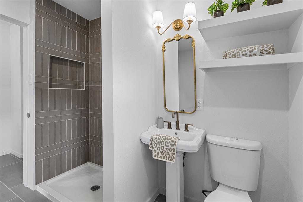 4723 El Campo Avenue Fort Worth, TX 76107 - Photo 14 of 21 a bathroom with a sink toilet and shower