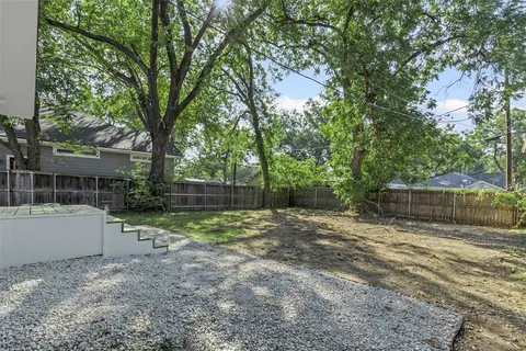 a view of backyard and tree