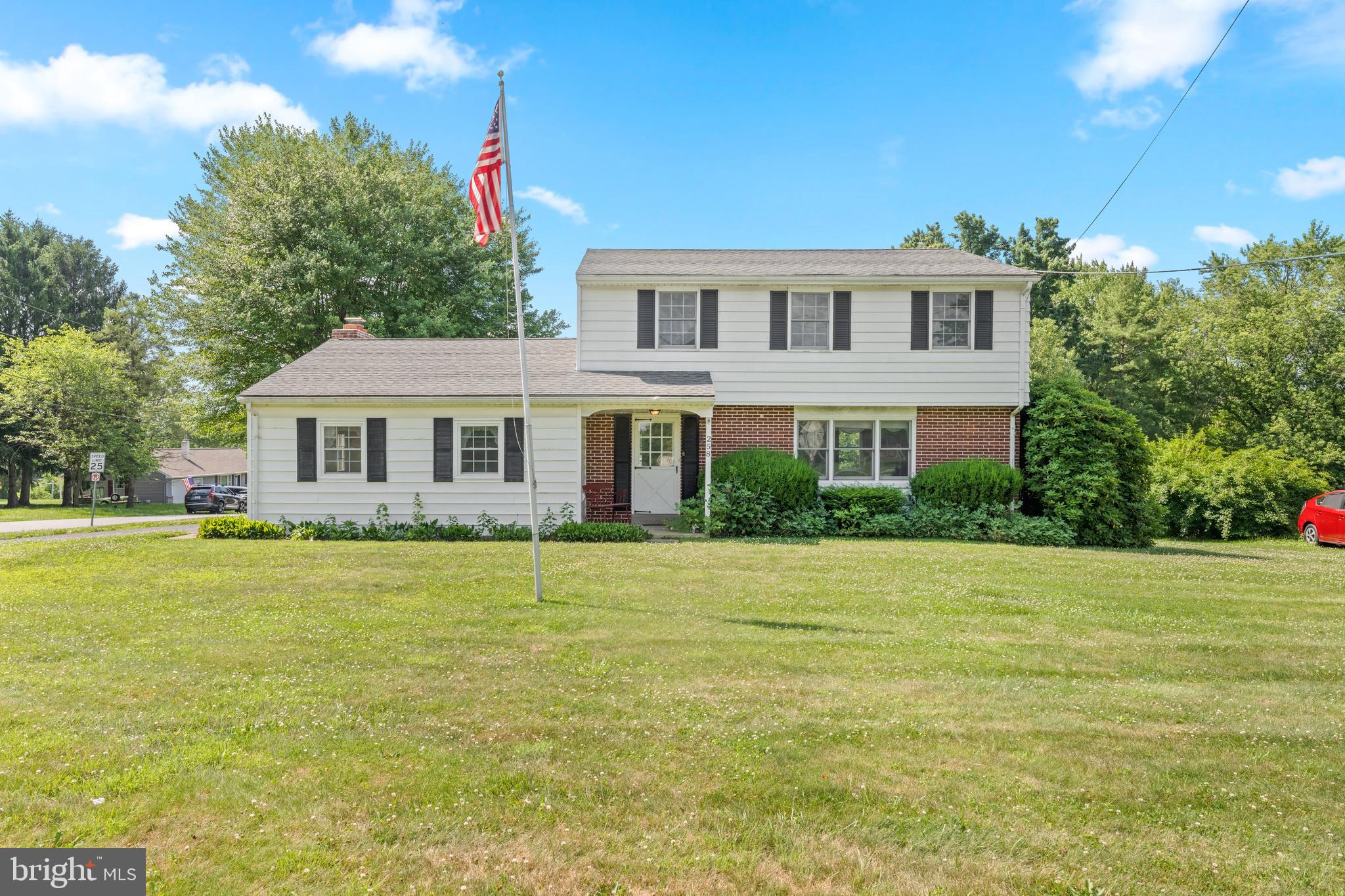 258 Monacy Road Coatesville, PA 19320 - Photo 1 of 54 a front view of a house with a garden