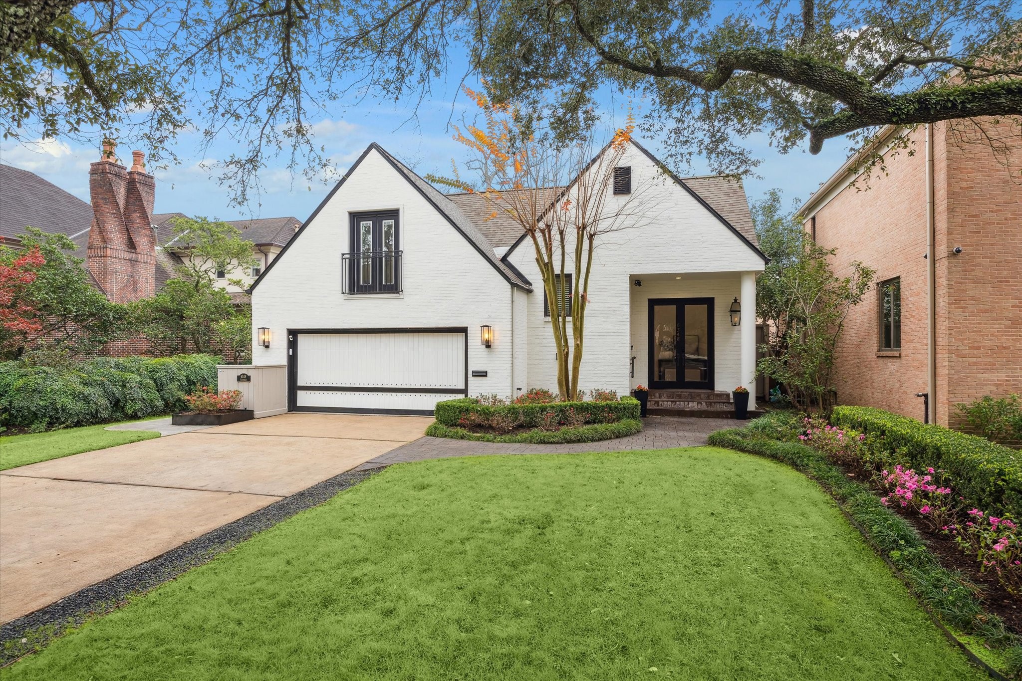 6348 Vanderbilt Street West University Place, TX 77005 - Photo 26 of 30 Welcome to 6348 Vanderbilt — where curb appeal sets the tone for everything that follows. This striking white brick home with bold black accents, a steeply pitched roofline, and Juliet balcony commands attention from the moment you arrive.