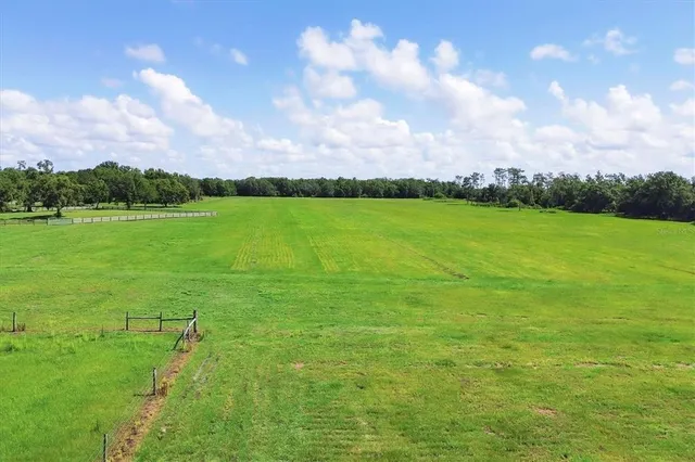 a view of an ocean and a yard