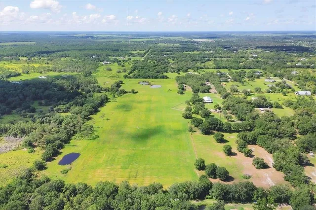 a view of a field with an ocean
