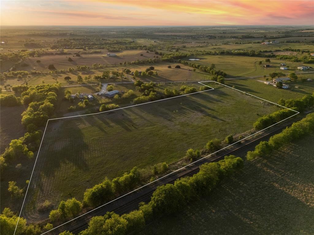 Tbd Willow Grove Road Moody, TX 76557 - Photo 3 of 23 Aerial view of a spacious land parcel featuring green fields and surrounding trees