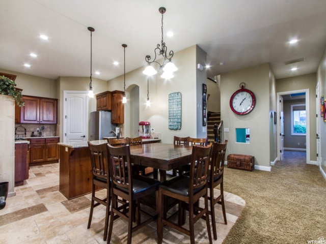4378 Foothill Drive Bountiful, UT 84010 - Photo 10 of 46 Kitchen and dining area featuring varied flooring, recessed lighting, and a chandelier