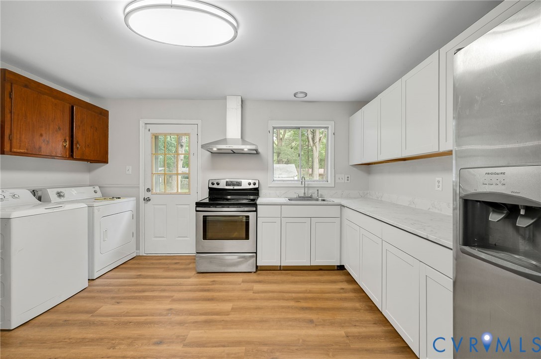 5322 Germain Road Richmond, VA 23224 - Photo 7 of 22 Open-concept kitchen featuring wood-finish floorin