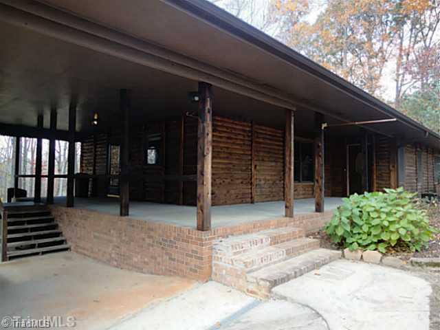 1136 Peabody Road Colfax, NC 27235 - Photo 2 of 16 Exterior Front. Wide, welcoming front porch was made for rocking chairs!