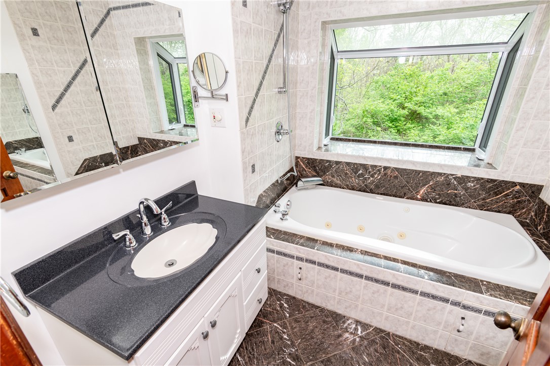 6750 Little Twin Road Germantown, OH 45327 - Photo 33 of 88 Luxurious bathroom with a spacious soaking tub and a bright window offering refreshing views.