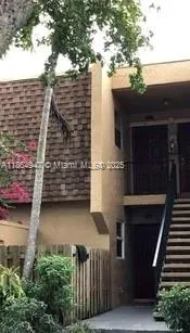 a view of a house with a street