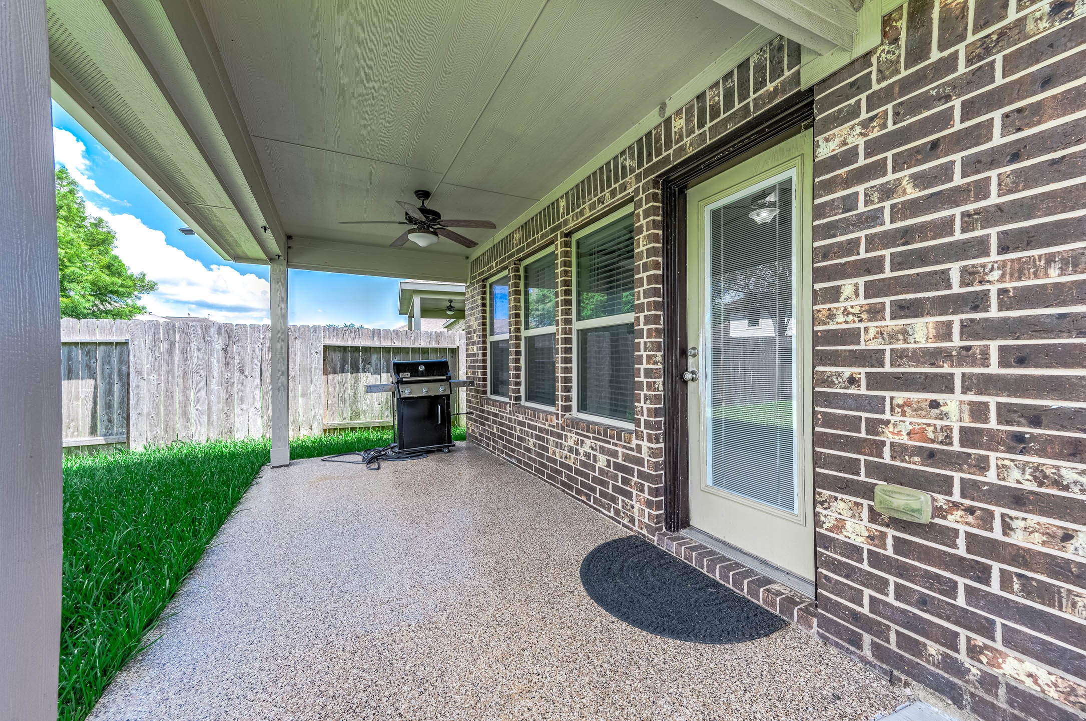 3050 Coreopsis Court Dickinson, TX 77539 - Photo 13 of 31 a view of a porch with furniture and a gate