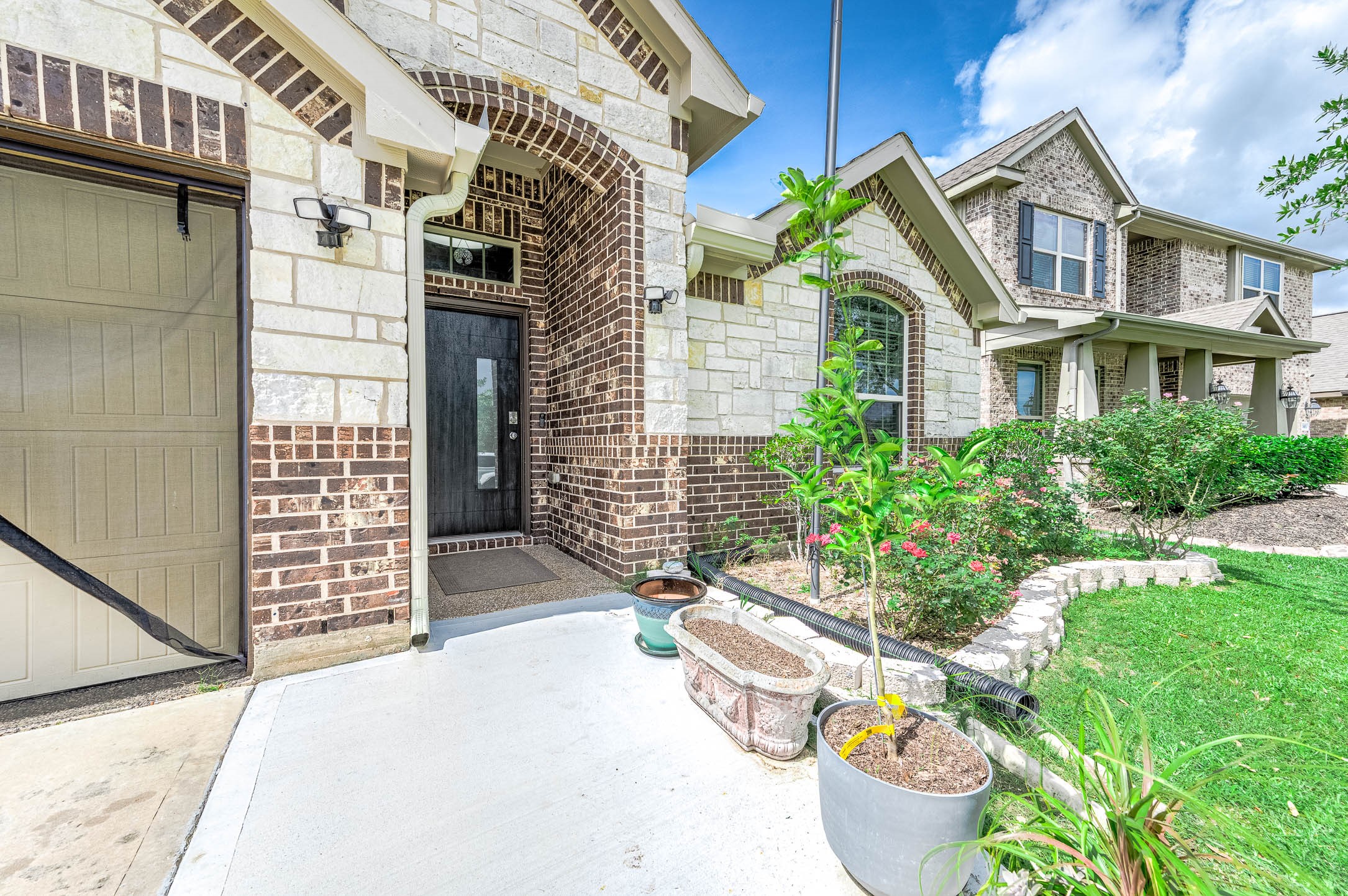 3050 Coreopsis Court Dickinson, TX 77539 - Photo 2 of 31 a front view of a house with outdoor seating