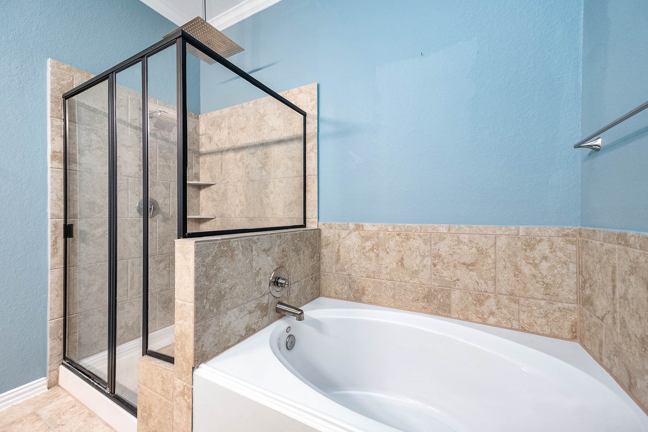 3050 Coreopsis Court Dickinson, TX 77539 - Photo 30 of 31 a bathroom with a bathtub and a shower