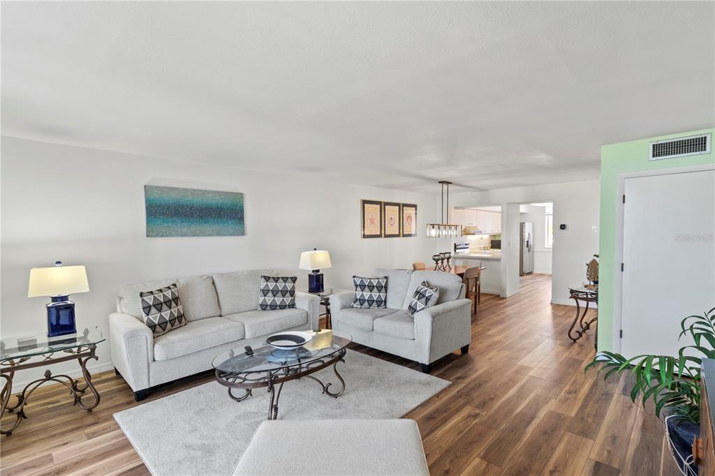 723 Bayport Way, Unit 723 Longboat Key, FL 34228 - Photo 14 of 67 a living room with furniture and a couch