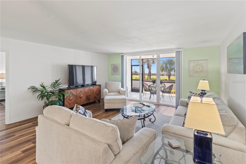 723 Bayport Way, Unit 723 Longboat Key, FL 34228 - Photo 16 of 67 a living room with furniture and a large window