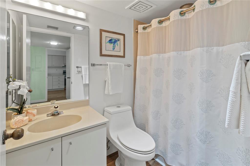 723 Bayport Way, Unit 723 Longboat Key, FL 34228 - Photo 27 of 67 a bathroom with a toilet sink and mirror