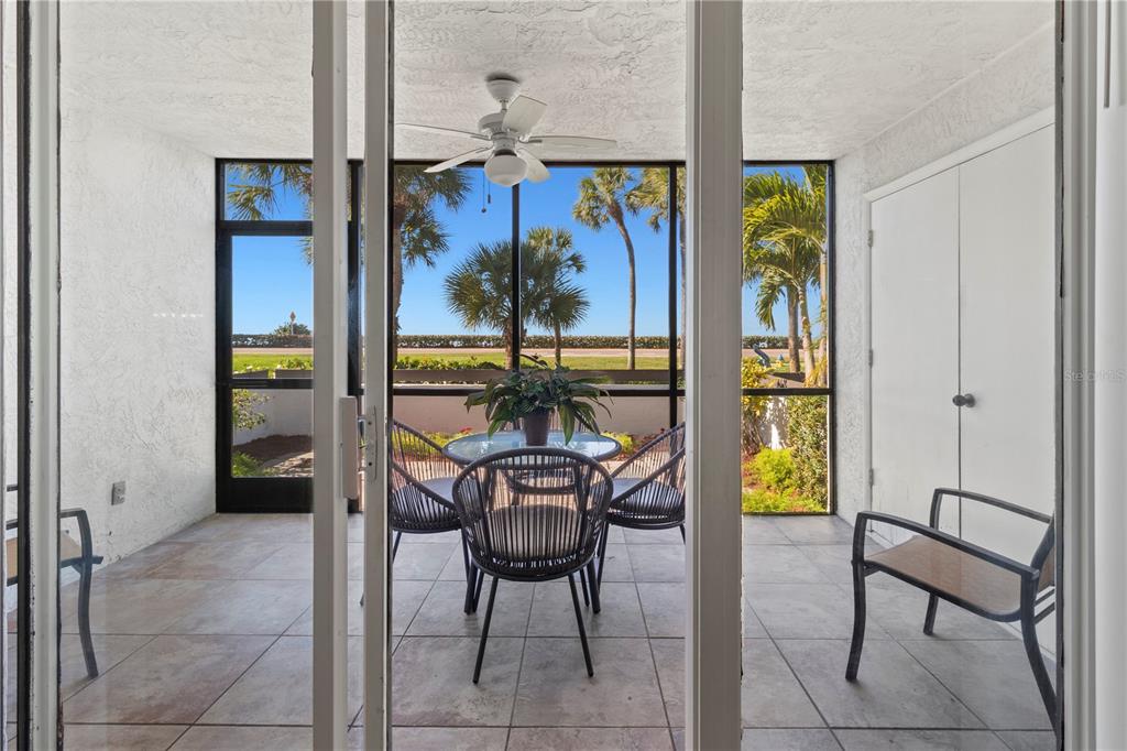 723 Bayport Way, Unit 723 Longboat Key, FL 34228 - Photo 30 of 67 a view of a dining room with furniture and window