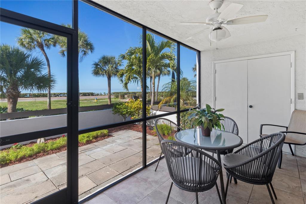 723 Bayport Way, Unit 723 Longboat Key, FL 34228 - Photo 31 of 67 a view of a swimming pool with a table and chairs