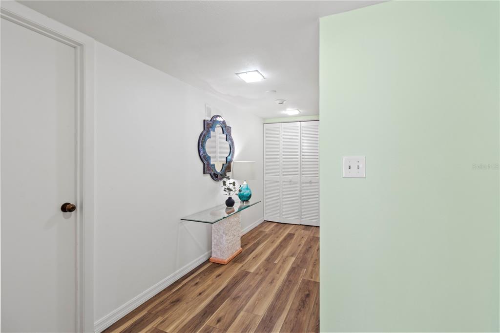 723 Bayport Way, Unit 723 Longboat Key, FL 34228 - Photo 5 of 67 a view of a livingroom with wooden floor