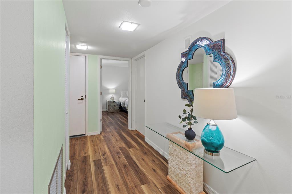 723 Bayport Way, Unit 723 Longboat Key, FL 34228 - Photo 6 of 67 a view of living room with furniture and wooden floor