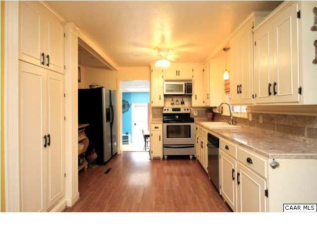 8607 3 Notch Road Louisa, VA 23093 - Photo 13 of 26 a kitchen with stainless steel appliances a stove a refrigerator and a oven