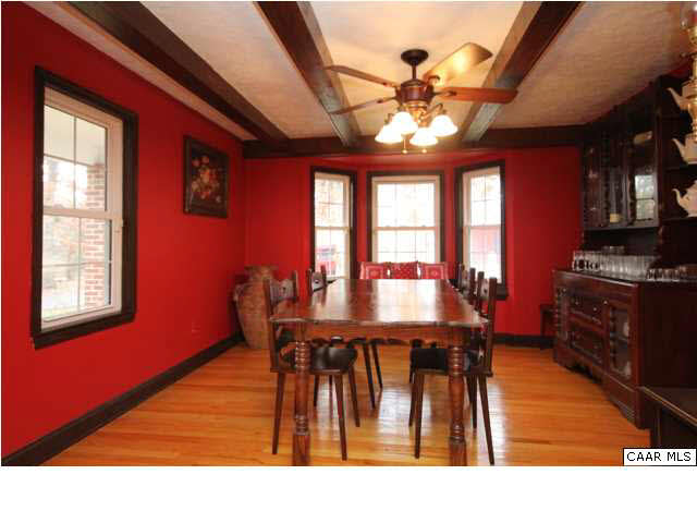 8607 3 Notch Road Louisa, VA 23093 - Photo 14 of 26 a dining room with furniture a chandelier and wooden floor